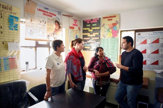 Fernando Sepulveda and his colleagues talking in a Bolivian healthcare centre.