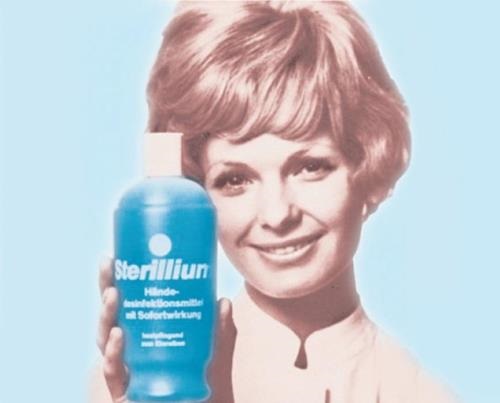 Historical advertisement picture portraying woman holding Sterillium