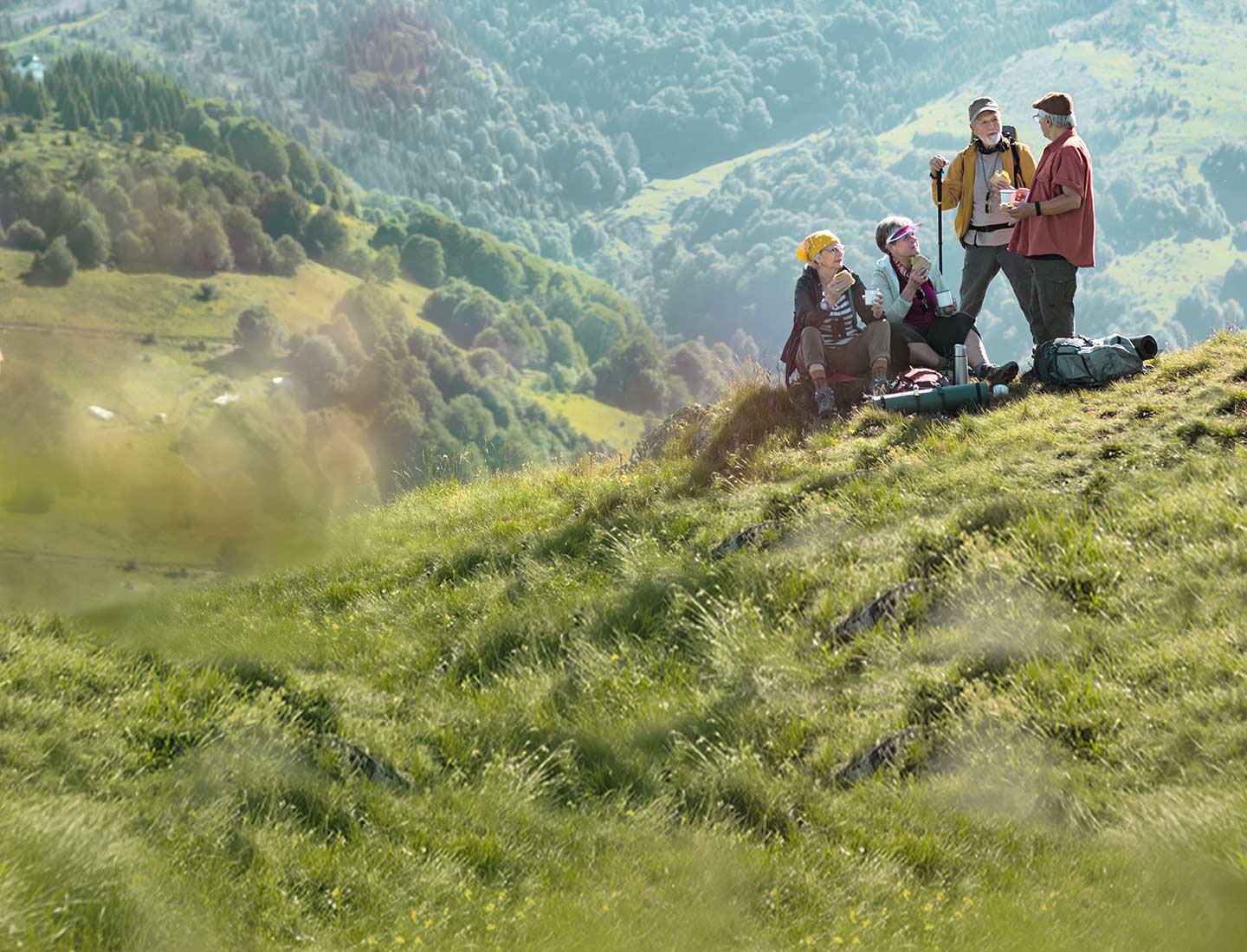 A group of people hiking, living an active life with incontinence