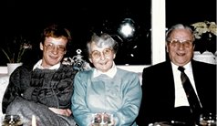 Andreas Schumacher sitting with his grandparents on a couch