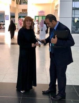 Cristina Popp at a meeting with a sales representative in Saudi Arabia.