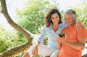 Happy Couple looking at smartphone together