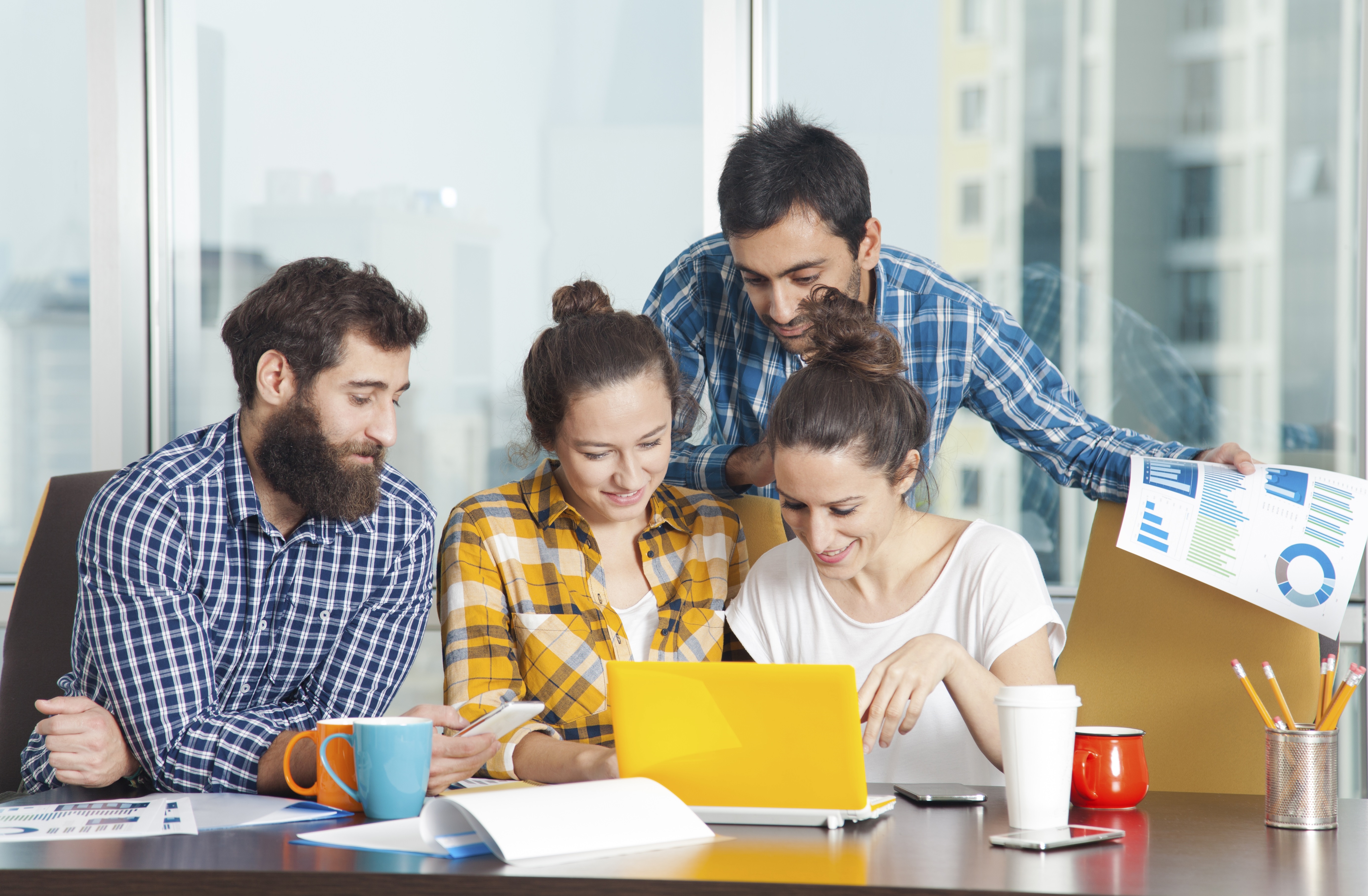 Group of young people working together at a table