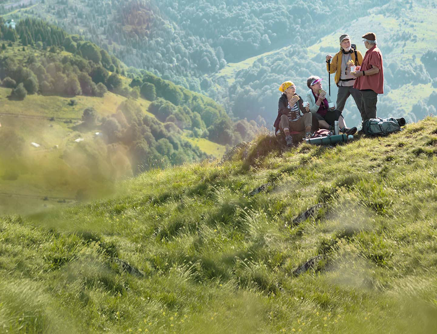 a group of people hiking, living an active life with incontinence