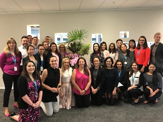 Group photo of Cassandra Cerecedo and her colleagues at a lunch event