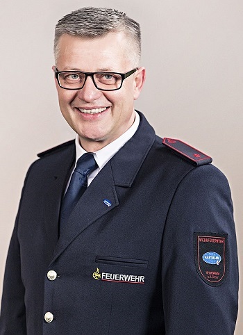 Portrait shot of Pawel Wojcik in his uniform