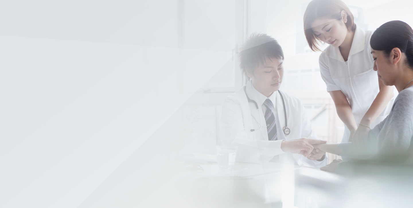 Portrait of confident doctors consulting patient in hospital