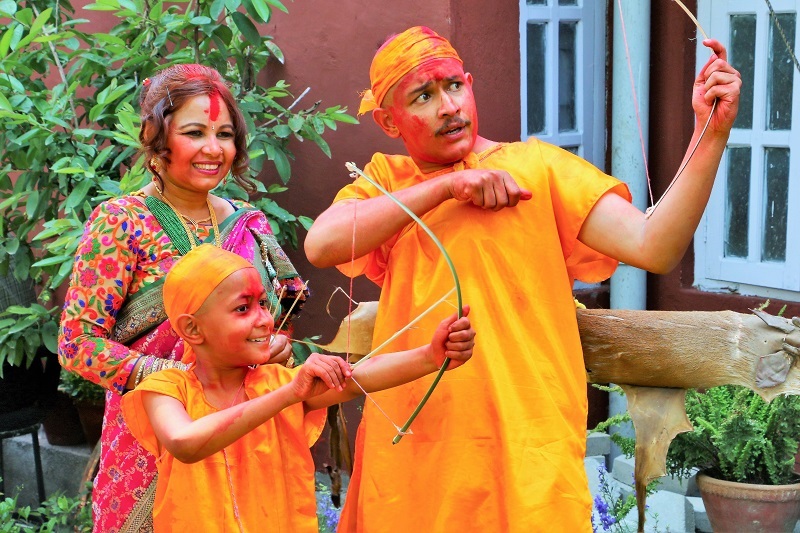 Nepalese mother, father and son at religious ceremony.