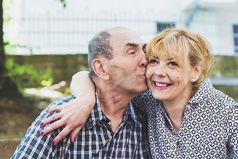 Old man and daughter caring