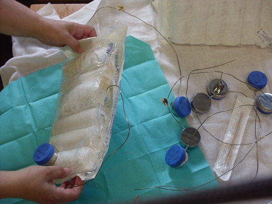 Hands are holding a test application for the sterilisation of products