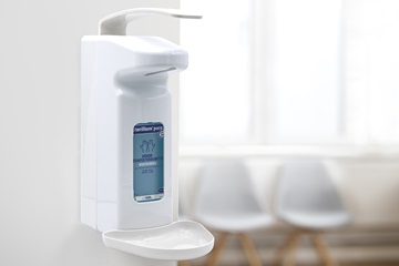 Disinfectant dispenser in the waiting area of a doctor's surgery.