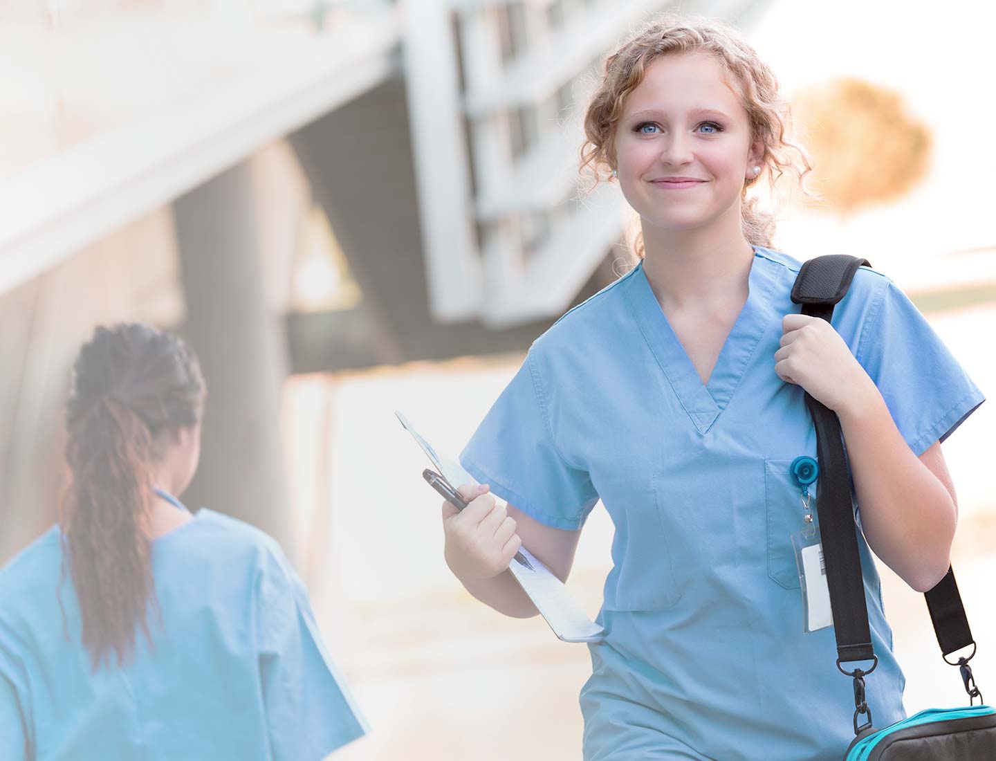 Nurse smiling and walking