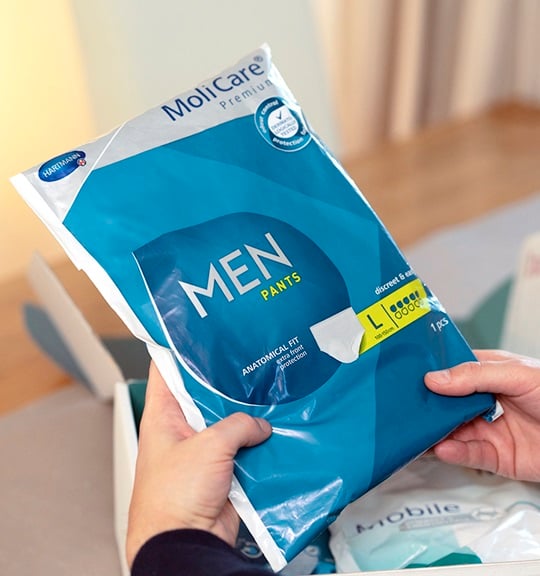 An elder man is happily smiling