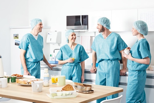 surgical teams on break chatting and laughing