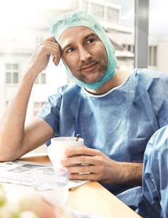 doctor having a break and drinking a cup of coffee