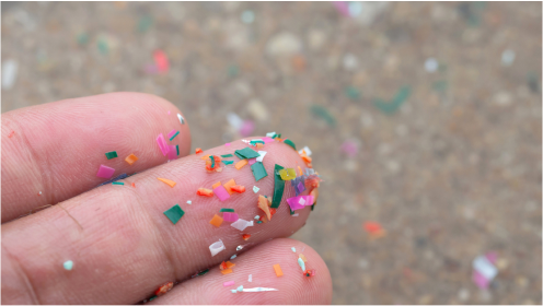 Close-up of microplastics on human hands.