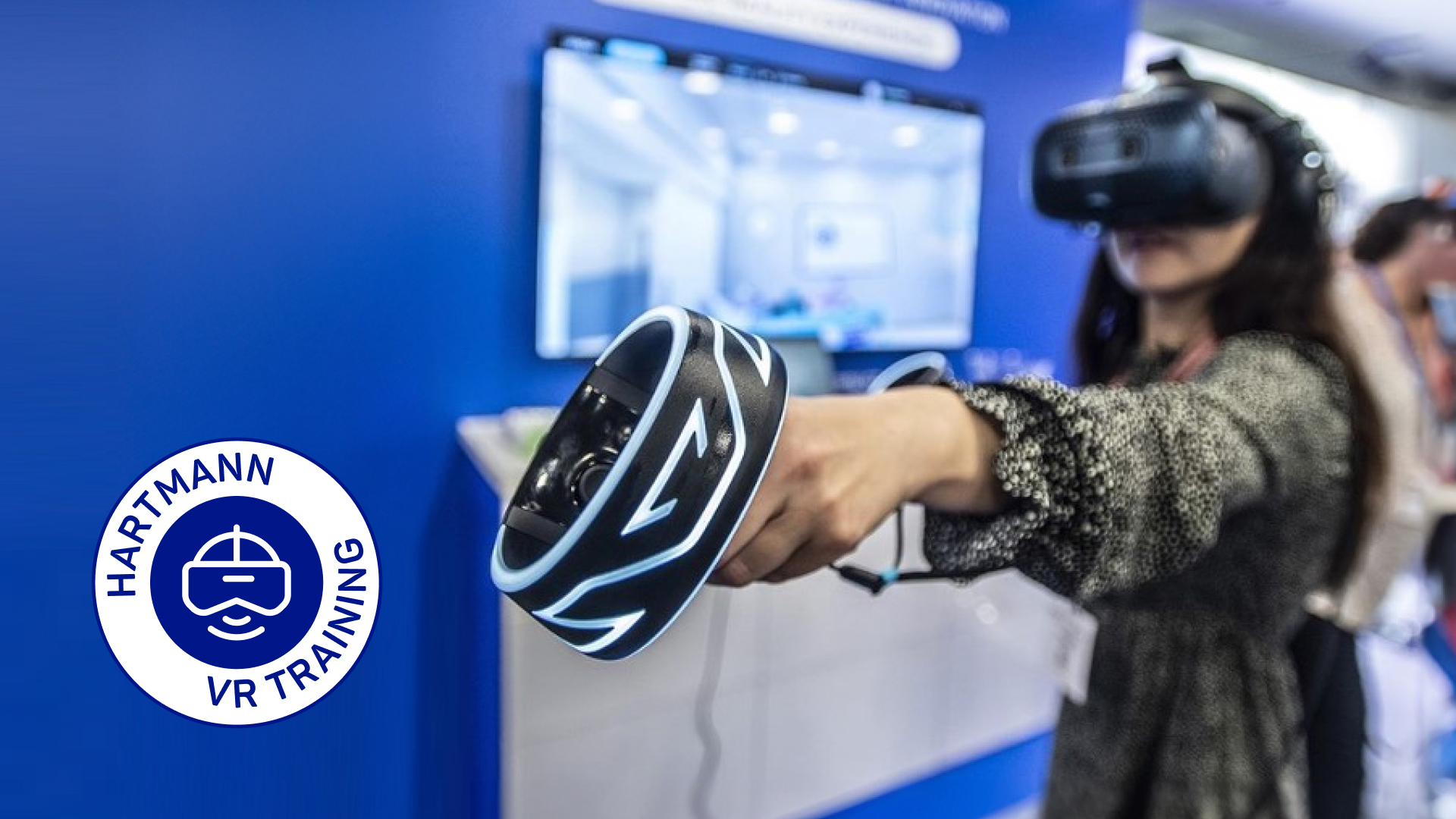 A woman wears a virtual reality headset and holds a joystick in her hand.