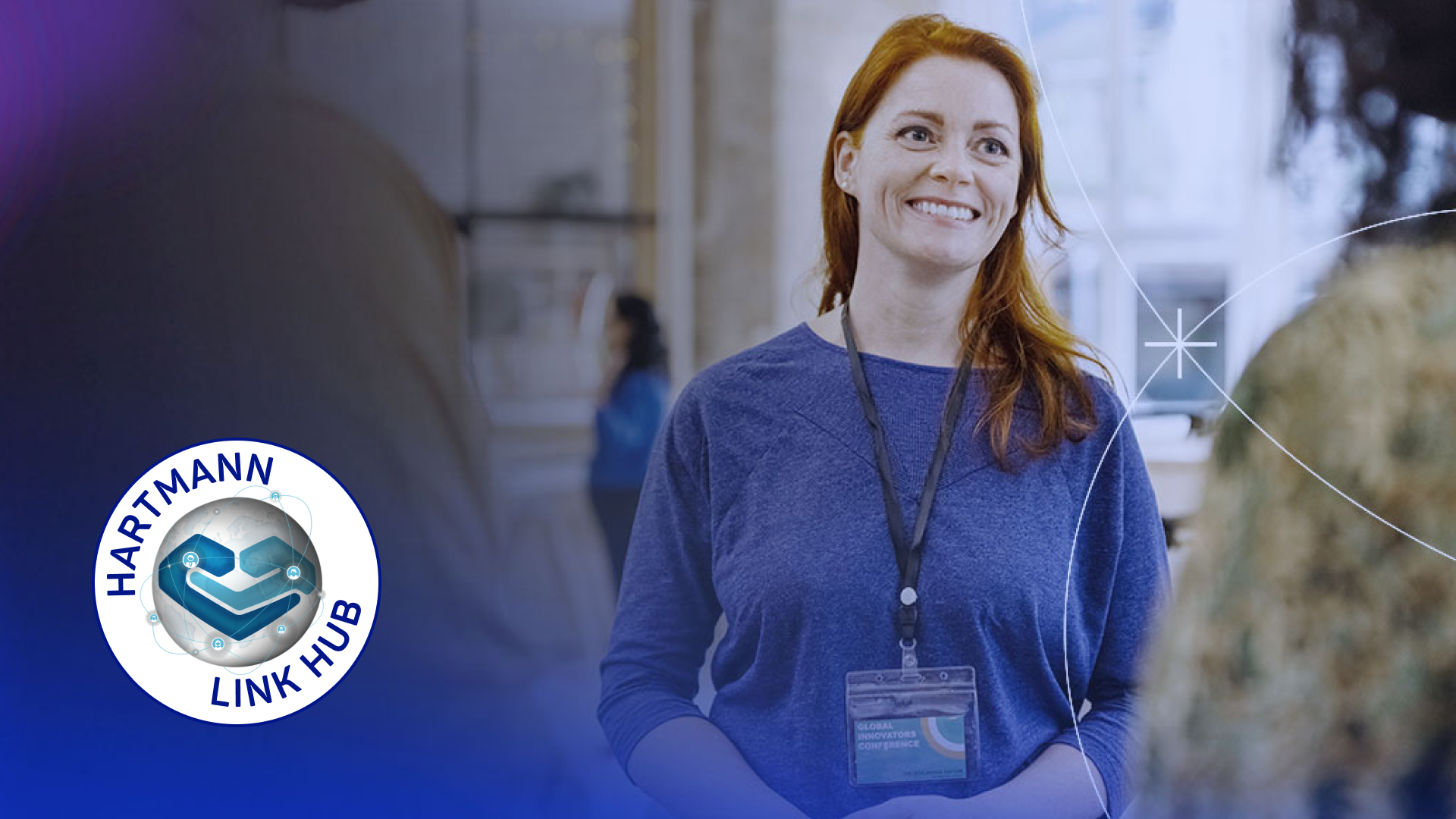 A smiling woman talking to other people in a group.