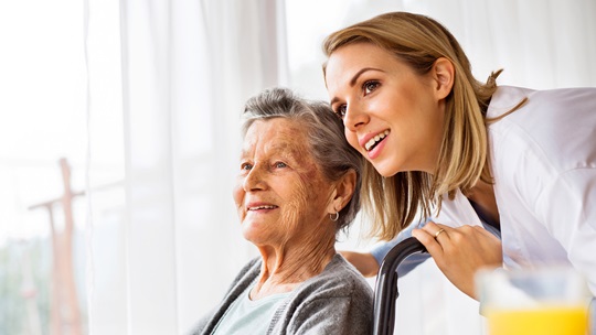 Image of a doctor and elderly person