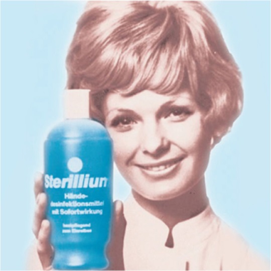 Sterillium® advertising poster from the 1960s, showing a woman holding a bottle of Sterillium in her hands.