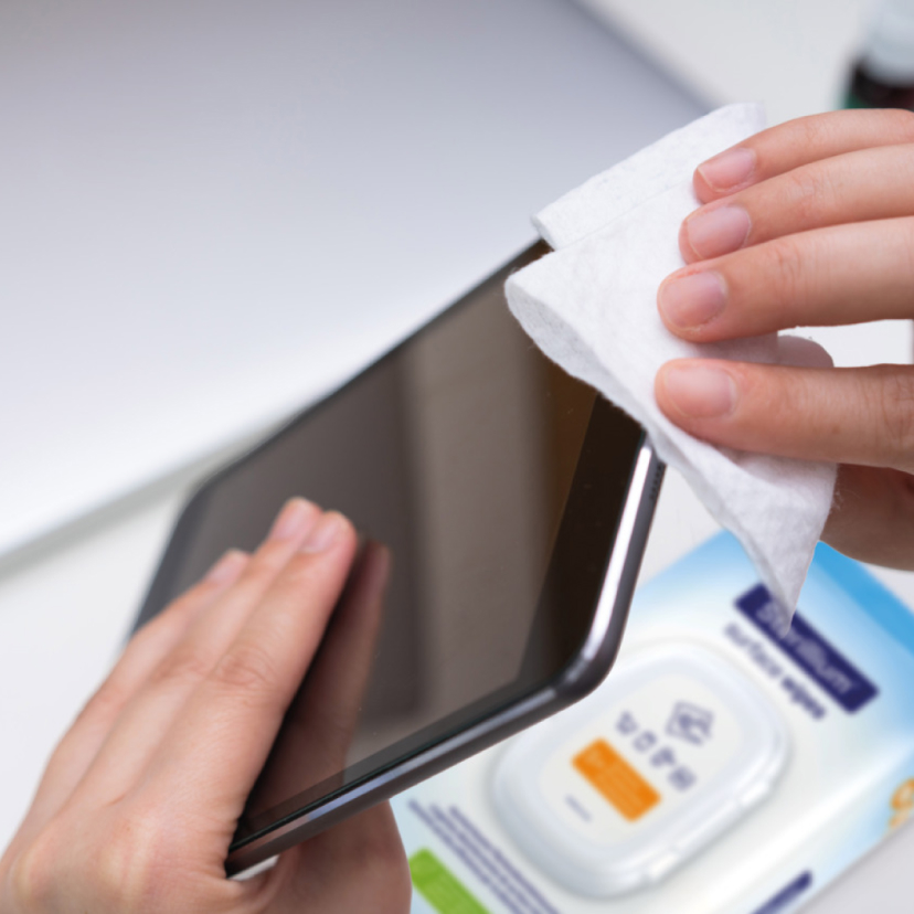 Someone cleans their tablet with Sterillium® surface wipes.