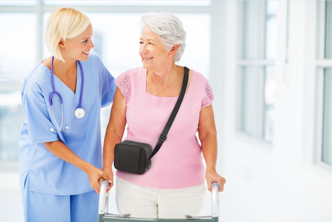 Nurse walking with a woman