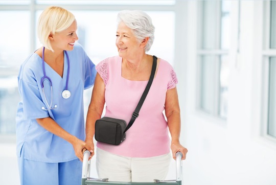 Nurse walking with a woman