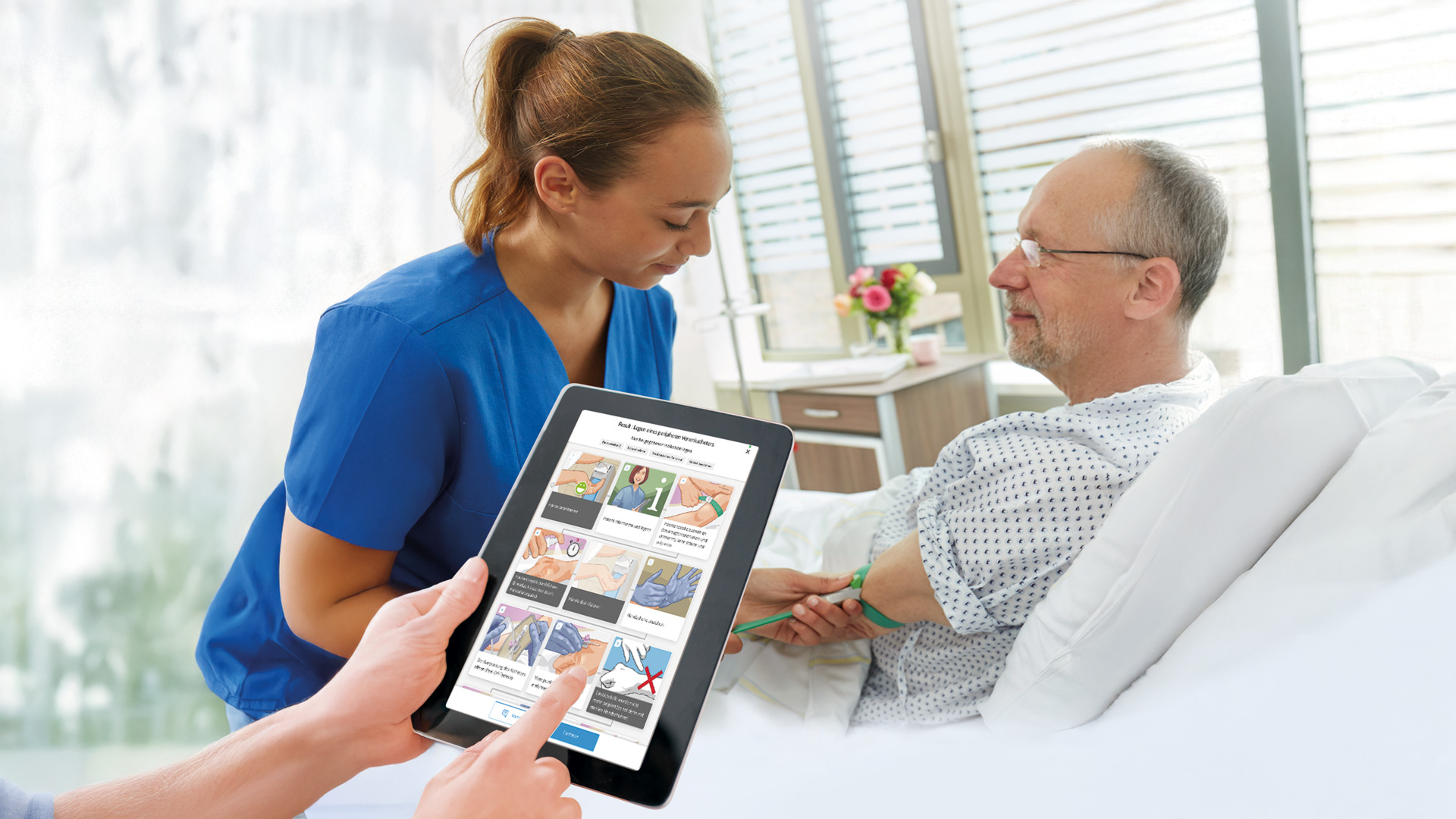  Nurse assisting a hospital patient while another person uses a tablet showing healthcare procedures, bright and modern setting.