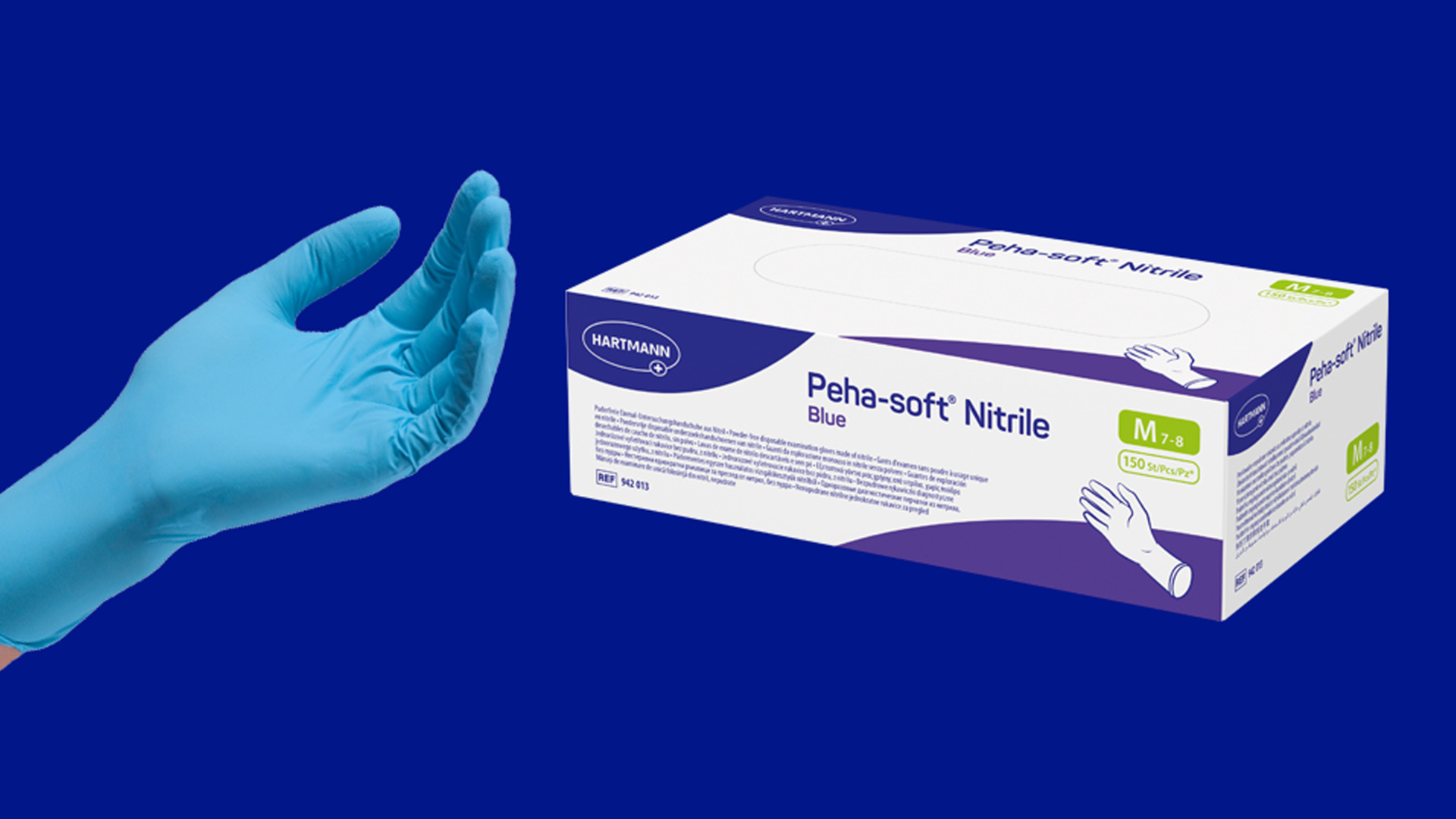  Blue nitrile glove worn on a hand next to a box labeled 'Peha-soft Nitrile Blue', highlighting the product's premium quality and comfort.
