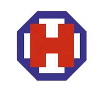 Modrý osmihran s bílým křížem a velkým červeným písmenem H ve středu tvoří logo značky HARTMANN z roku 1920.