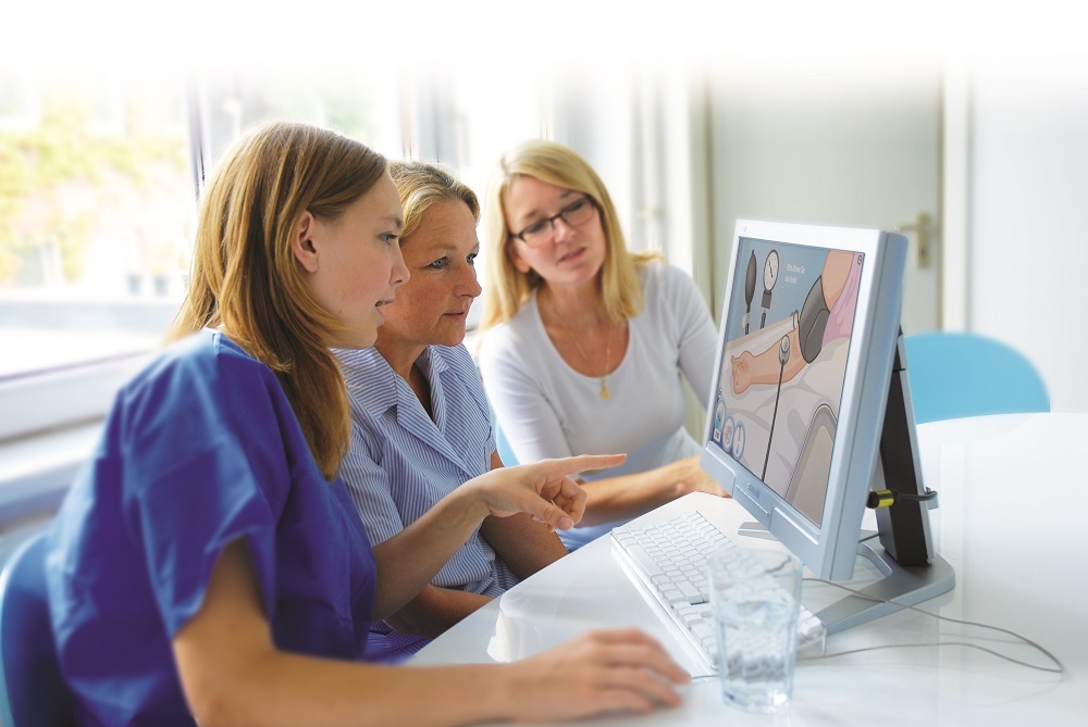 women looking on a screen in hospital