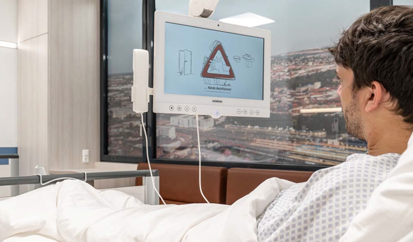 Bedside terminal with swivelling arm