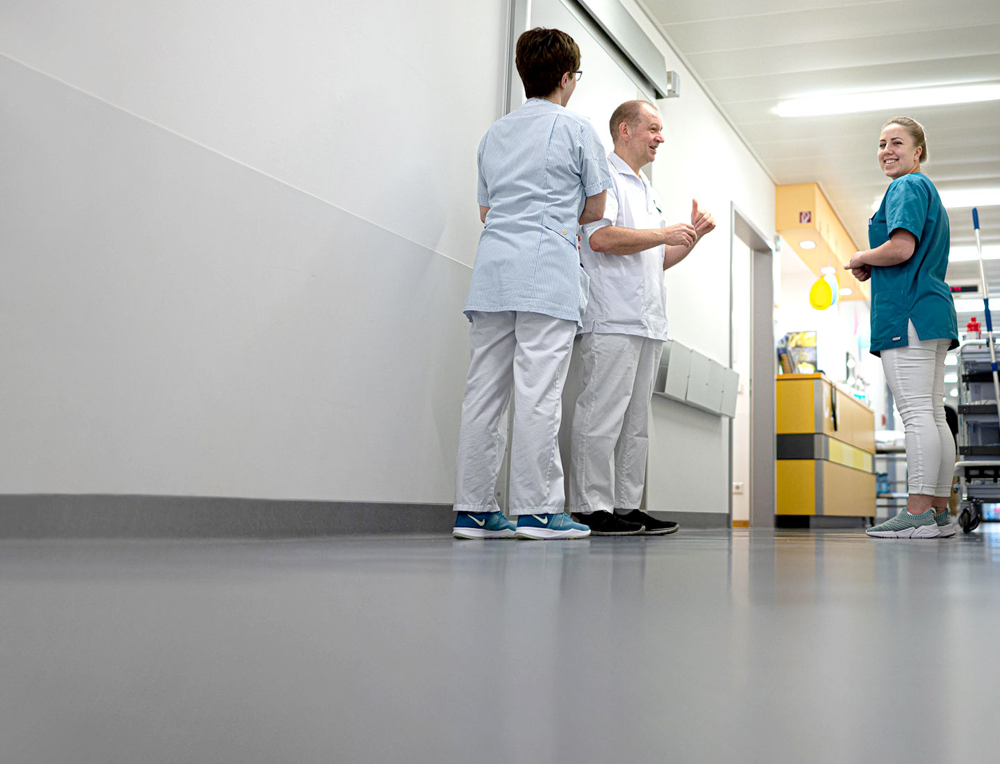 Nurses chatting in hospital hallway