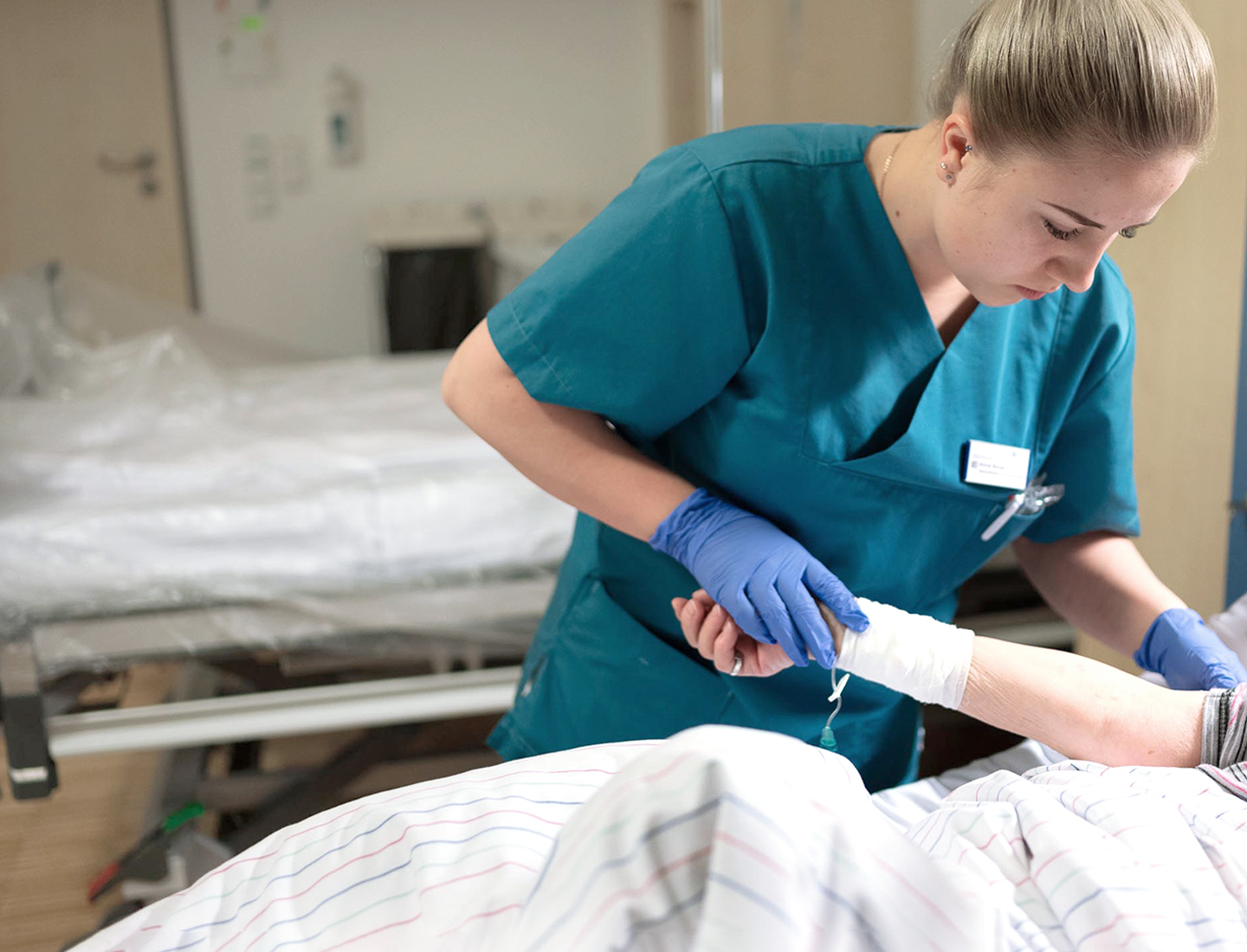 Nurse examining hospital patient