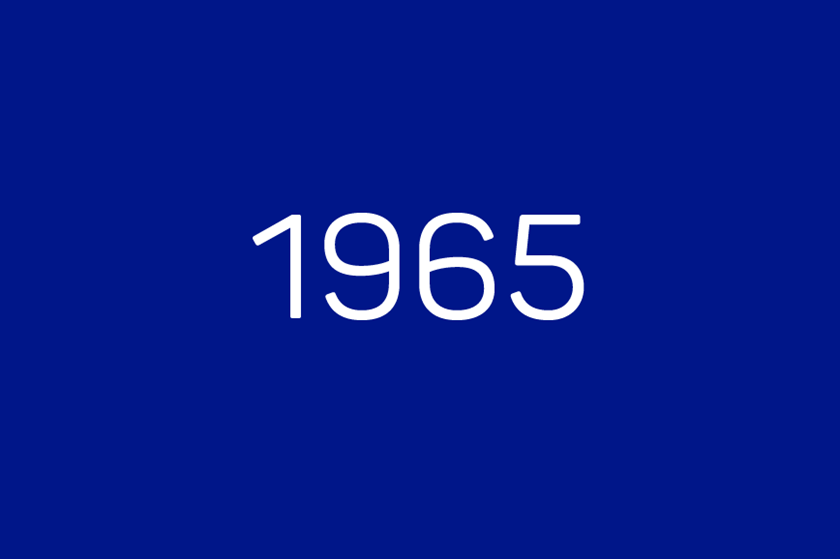 White lettering on dark blue background: 1965
