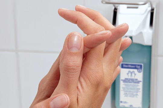 Close-up: Hands being disinfected.