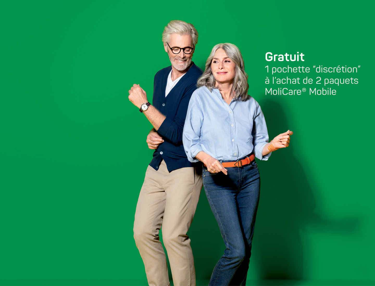 Happy mature couple on green background with campaign pay-off