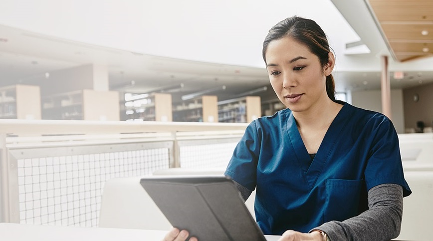Image of a woman with a device